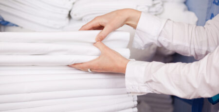 Freshly pressed bed linen as an example of a linen store for TDS Commercial blog